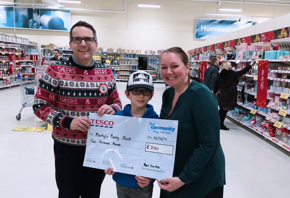 Sarah and Marty fundraising in Tesco