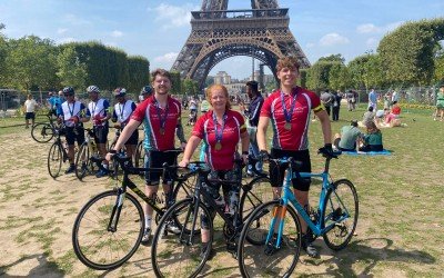 Kyren and the boys at the Eiffel Tower after finishing the challenge