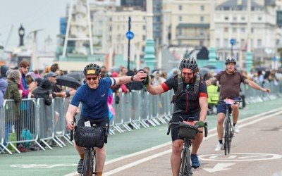 CYCLISTS CROSSING THE FINISH LINE