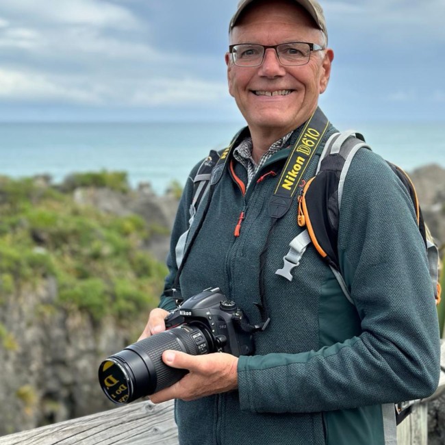 A photo of Andy holding a camera